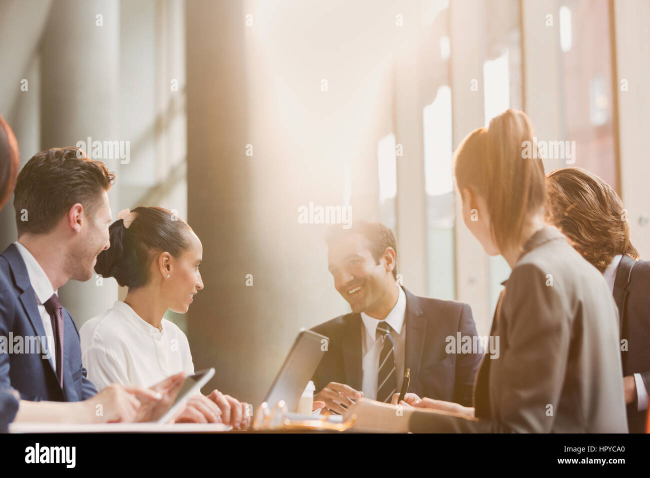 Smiling businessman leading conference room meeting Stock Photo Alamy