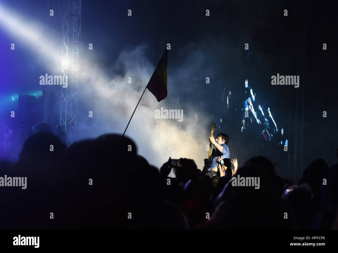 BONTIDA, ROMANIA - JULY 15, 2016: Bass guitarist Chris Batten from Enter Shikari British rock band crowd surfing during a concert at Electric Castle f Stock Photo