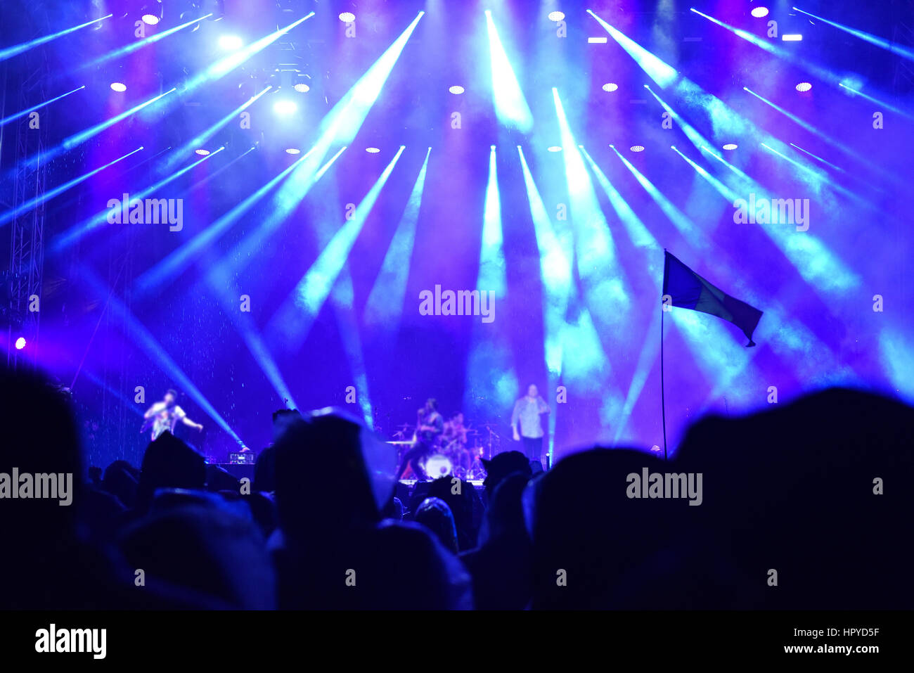 Crowd at a live concert. Stage lights in the background Stock Photo - Alamy