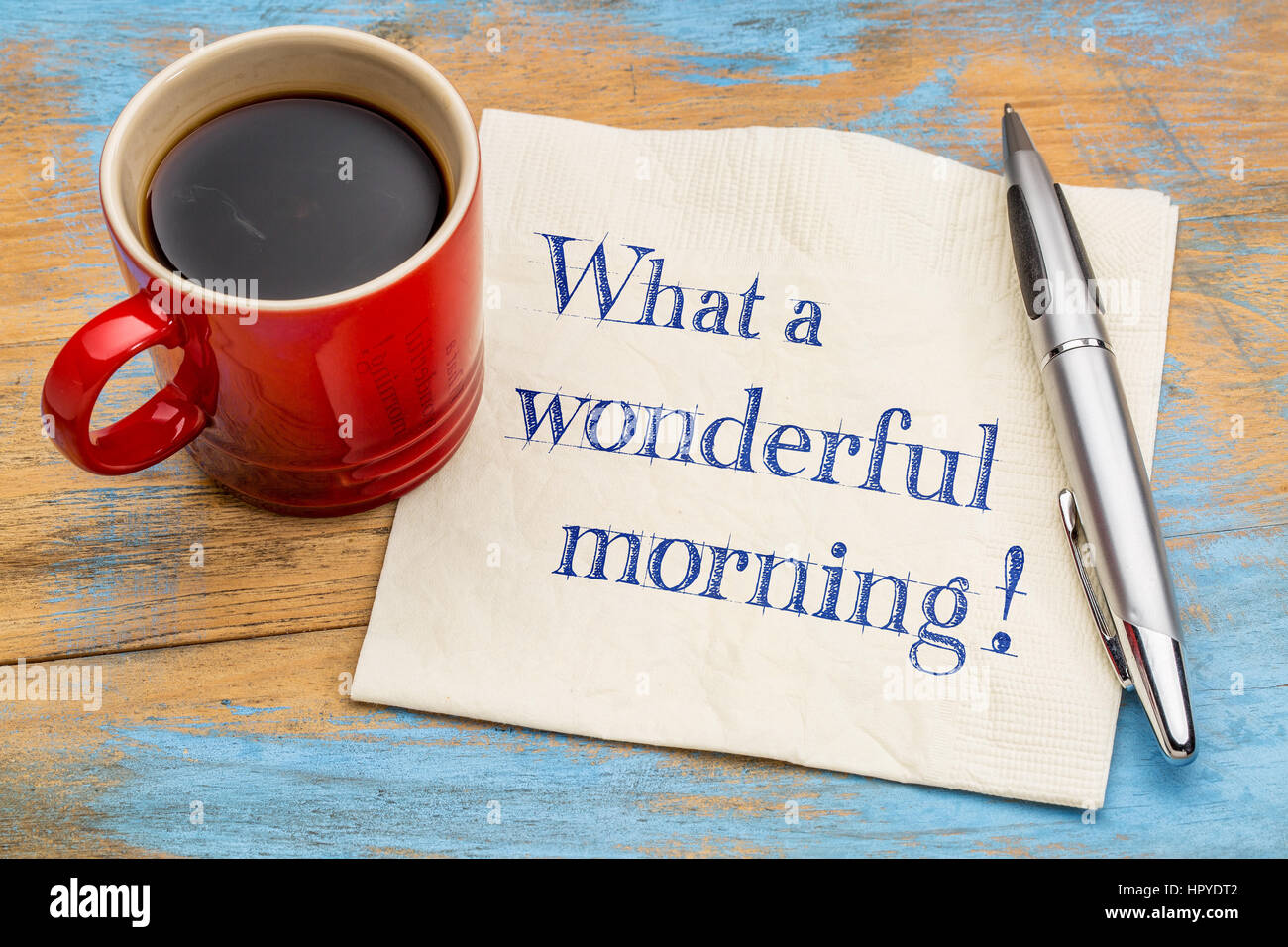 What a wonderful morning - handwriting on a napkin with a cup of coffee Stock Photo