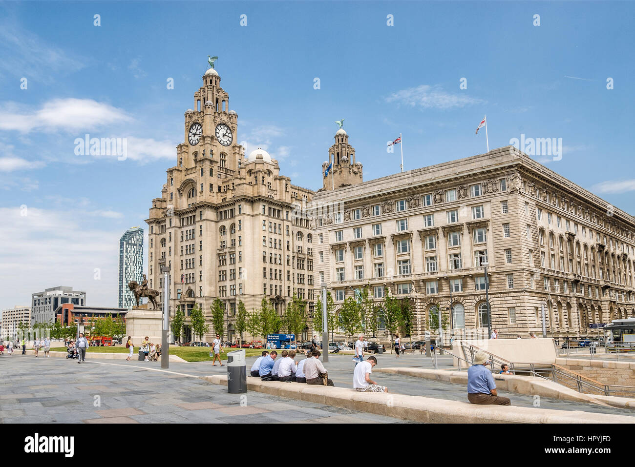 The historic Pier Head riverfront site  in the city centre of Liverpool, England. It encompasses a trio of landmarks, built on the site of the former  Stock Photo