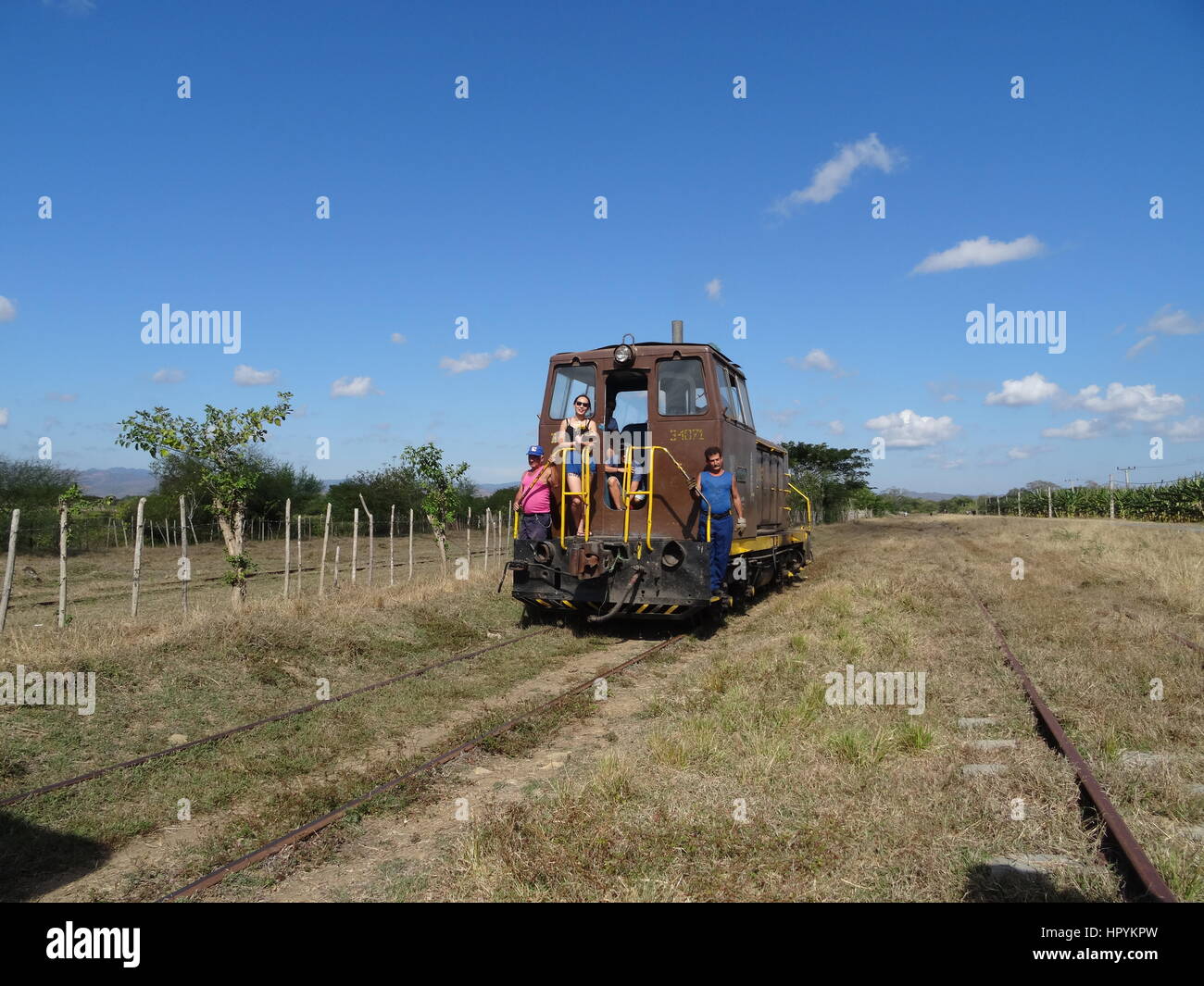 Old train on railtrack in the cuban countryside landscape from the Valle de los Ingenios near Trinidad Stock Photo