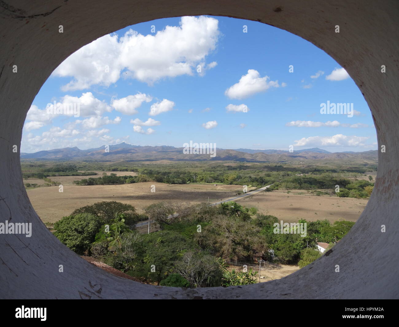 Aerial view framed by oval wall of the countryside in the Valle de los Ingenios near Trinidad,Cuba Stock Photo