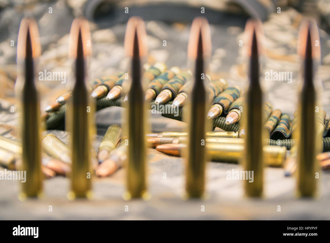 Hollow point ammunitions for rifle on camouflage background. Stock Photo