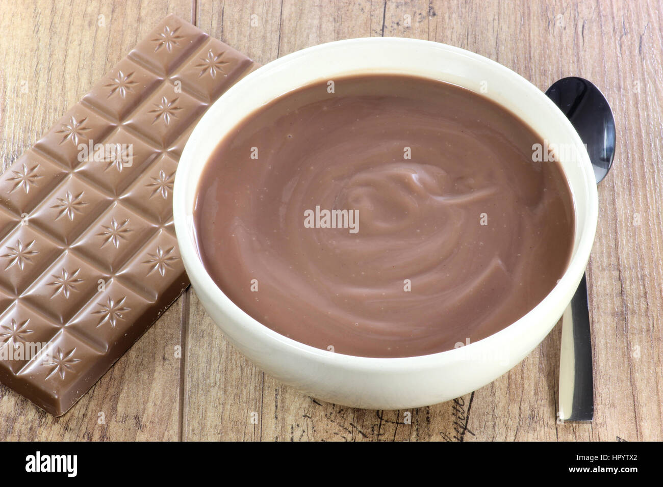 chocolate pudding in a bowl on wooden background Stock Photo