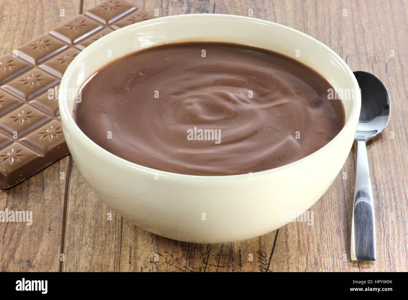 chocolate pudding in a bowl on wooden background Stock Photo