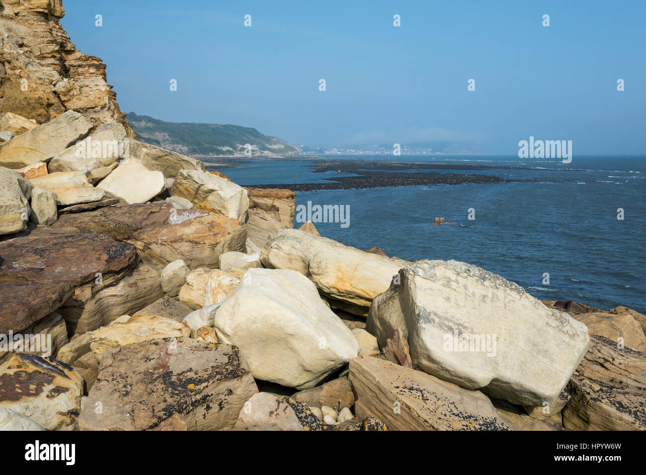 View from Knipe point (Osgodby point) near Scarborough on the coast of North Yorkshire, England. A beautiful sunny day on the rocky headland. Stock Photo