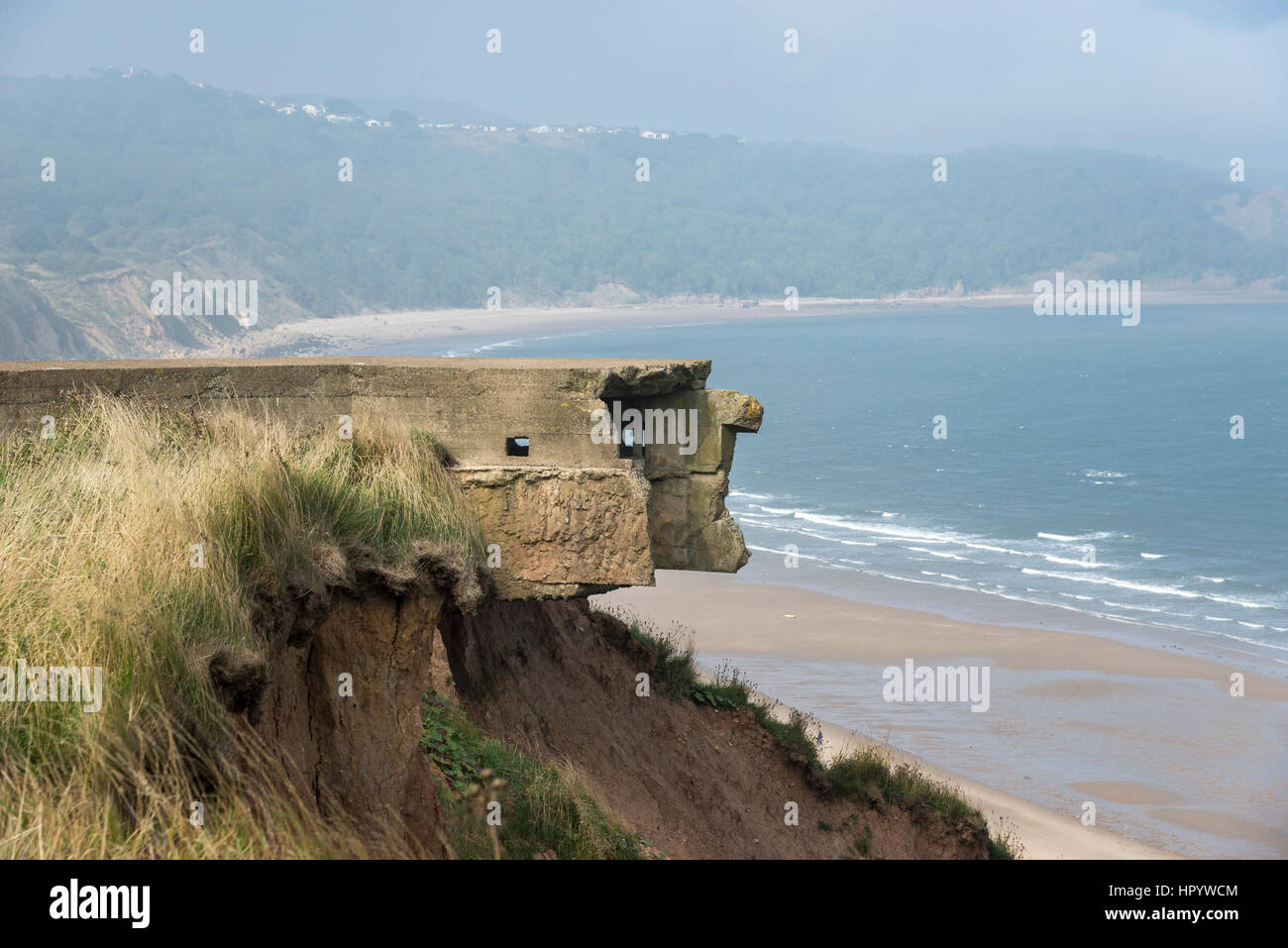 Remains of coastal defenses in the eroding cliffs above Cayton bay near Scarborough, North Yorkshire, England. Stock Photo