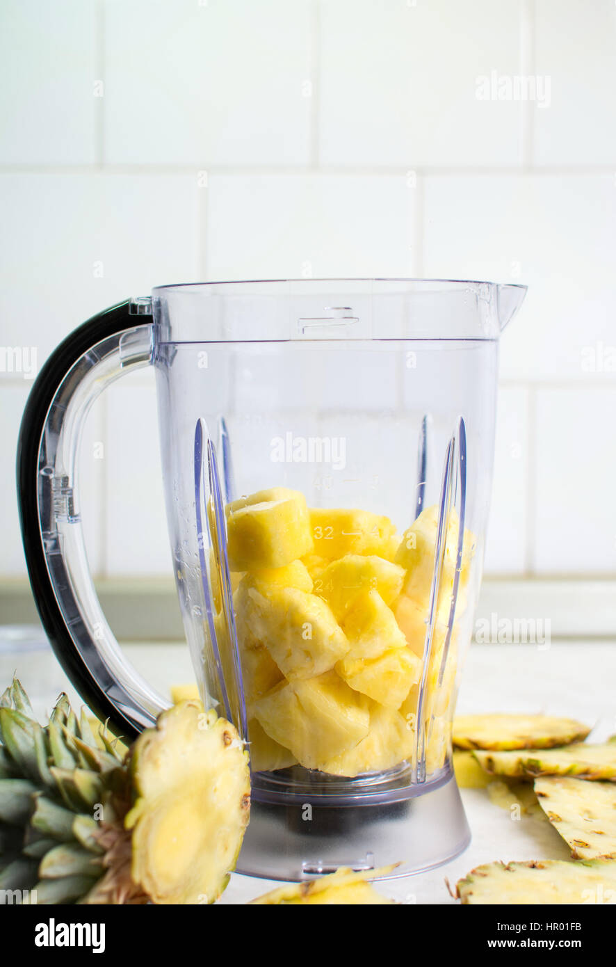 Pineapple in a blender for homemade smoothie Stock Photo Alamy
