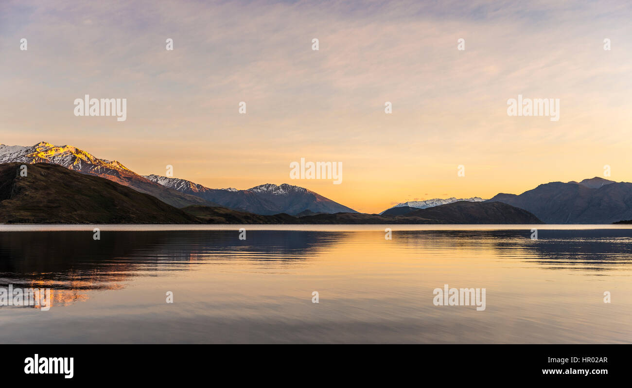 Sunrise, morning atmosphere, mountains reflected in Wanaka Lake, Rocky Peak, Glendhu Bay, Otago, Southland, New Zealand Stock Photo