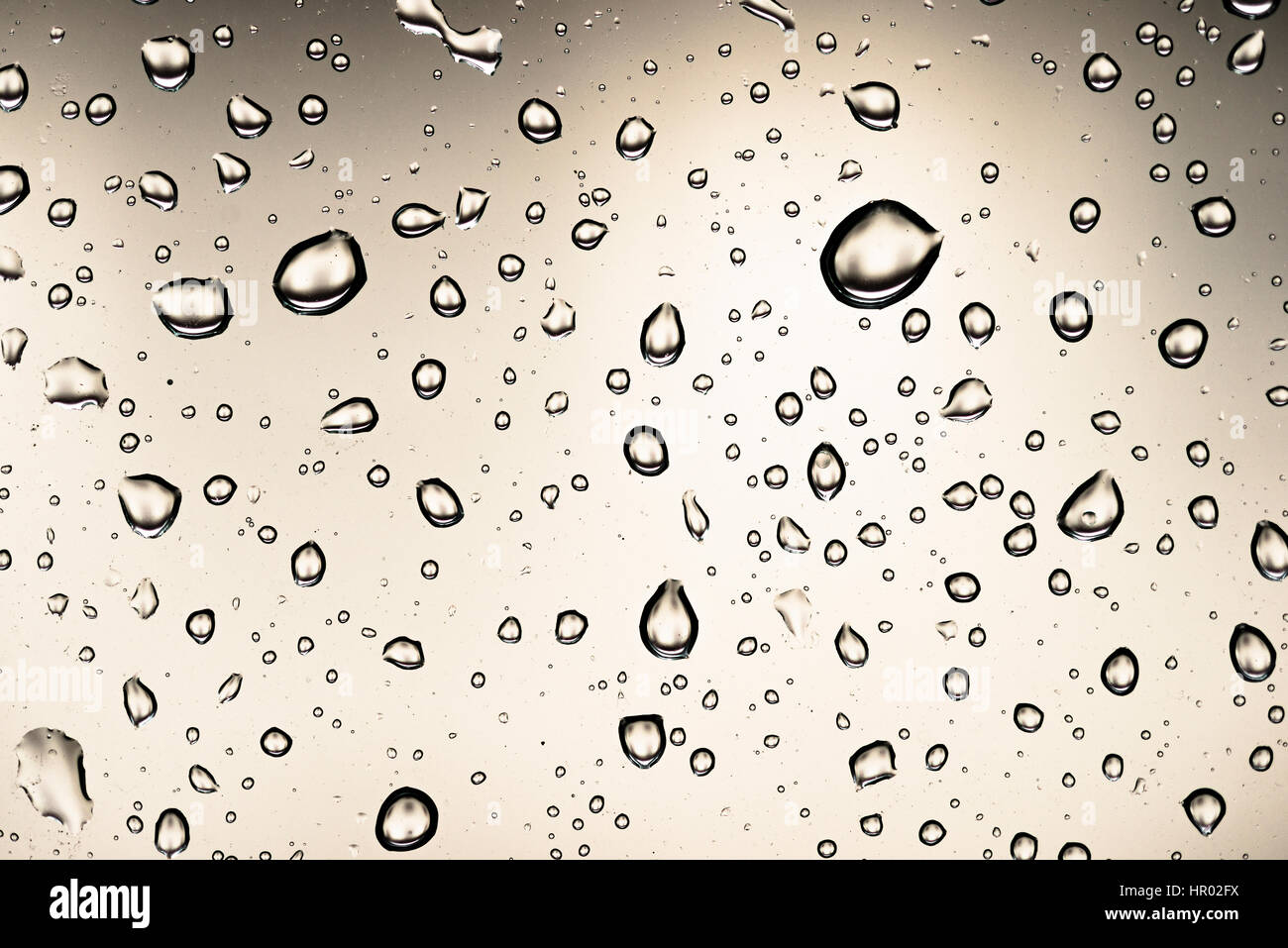 Water drops on a window pane, glass pane, window, rain, bad weather, full-frame, background image Stock Photo