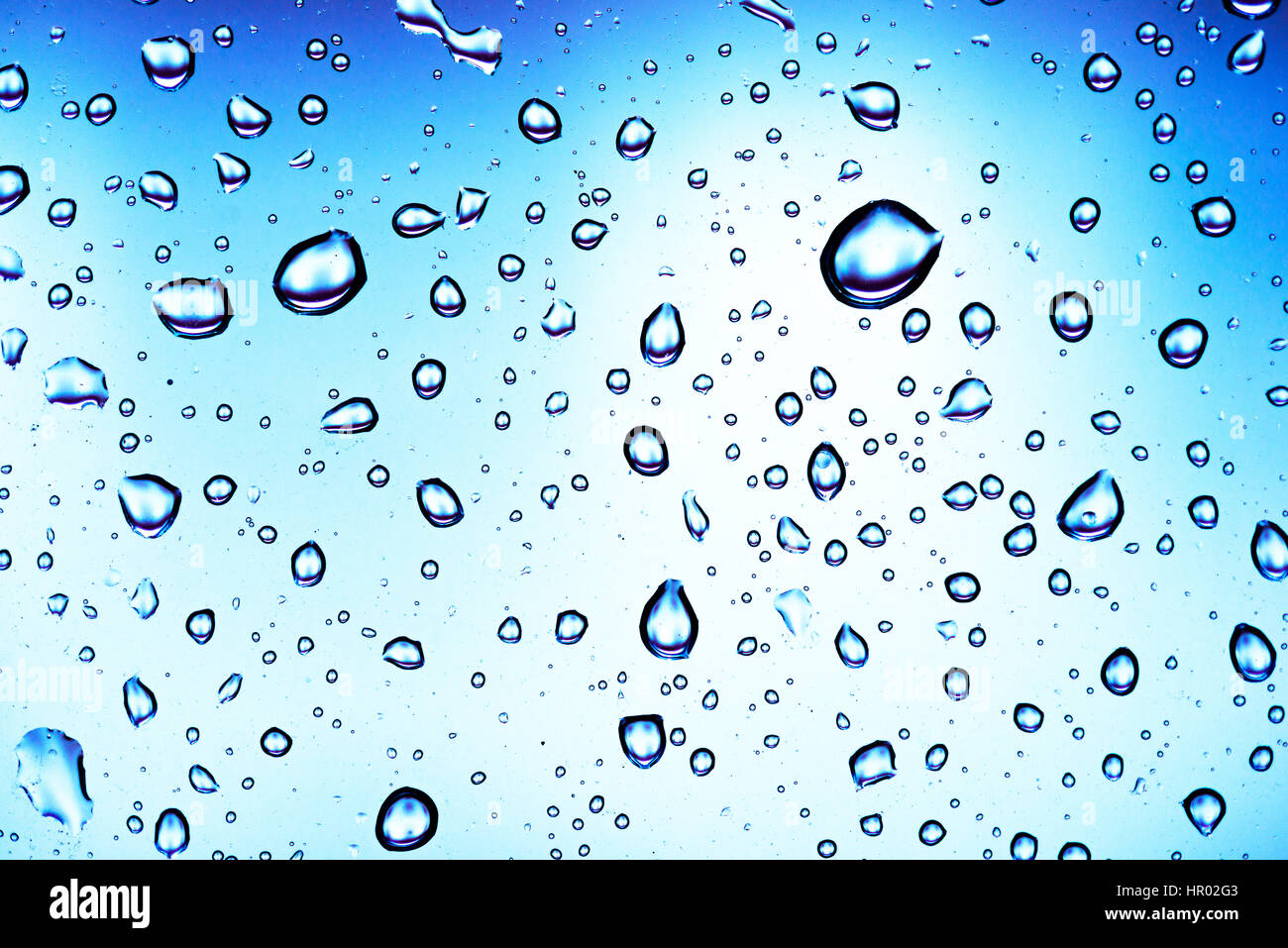 Water drops on a window pane, glass pane, window, rain, bad weather, full-frame, background image Stock Photo