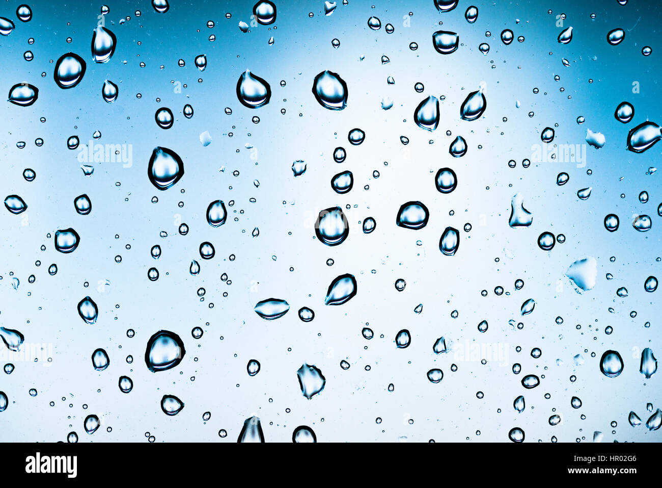 Water drops on a window pane, glass pane, window, rain, bad weather, full-frame, background image Stock Photo