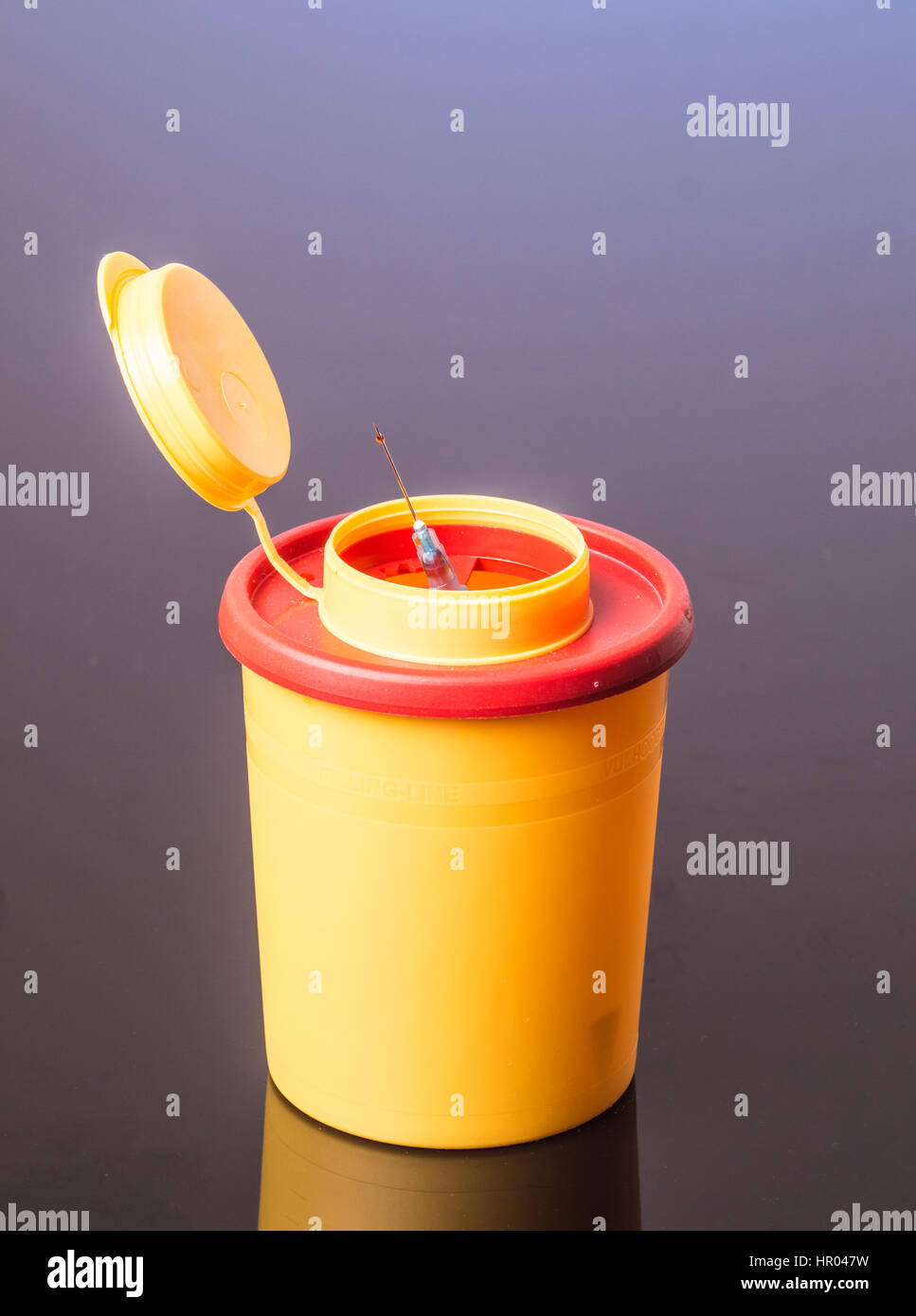 Yellow medical needle disposal waste container, syringe needle with red