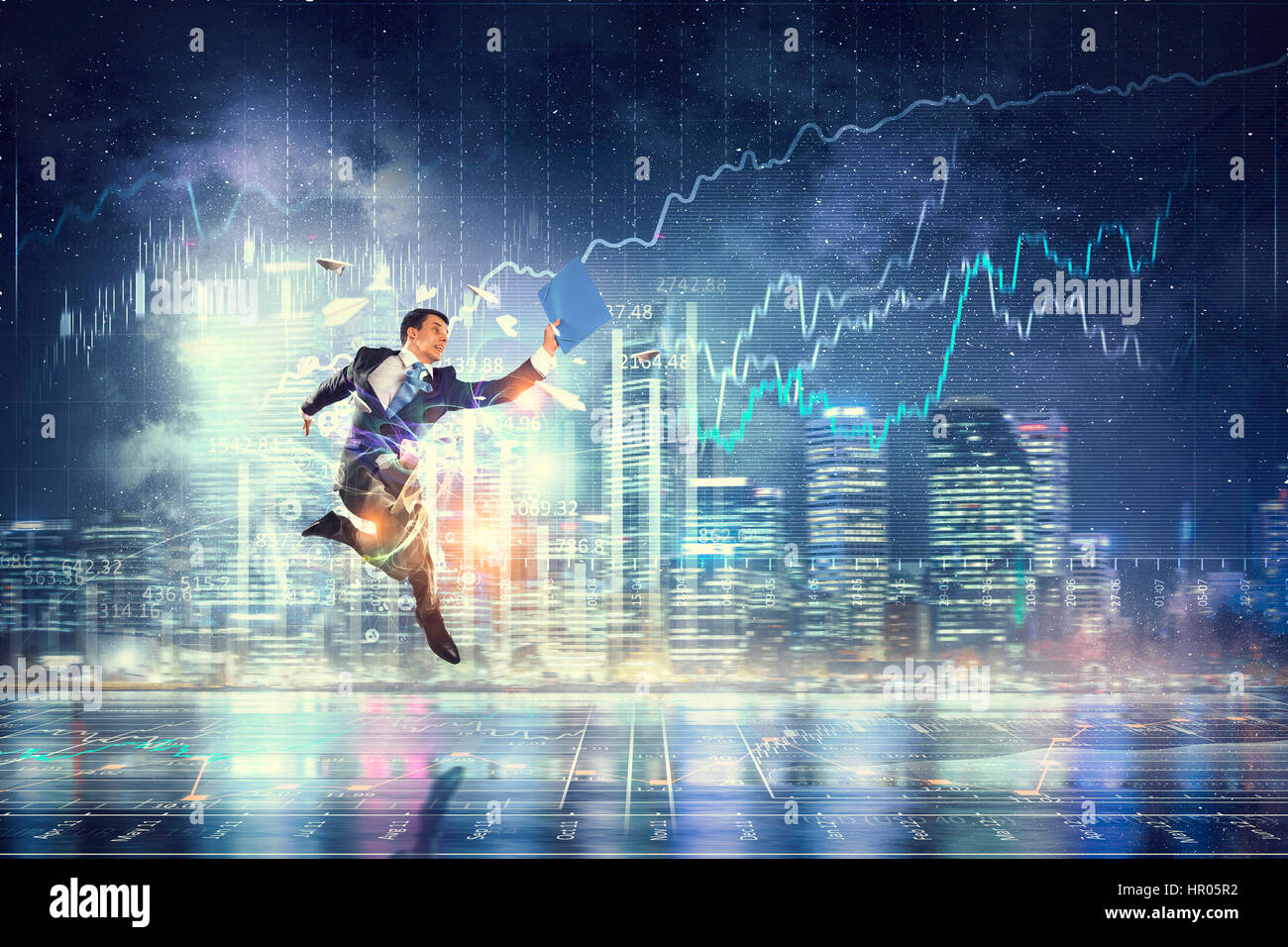 Businessman celebrating success . Mixed media Stock Photo - Alamy