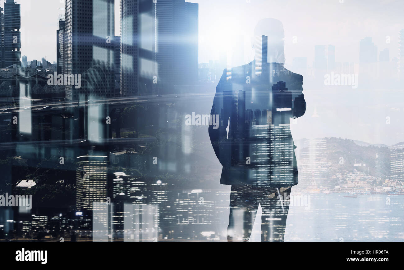 Exposure of businessman and cityscape . Mixed media Stock Photo - Alamy