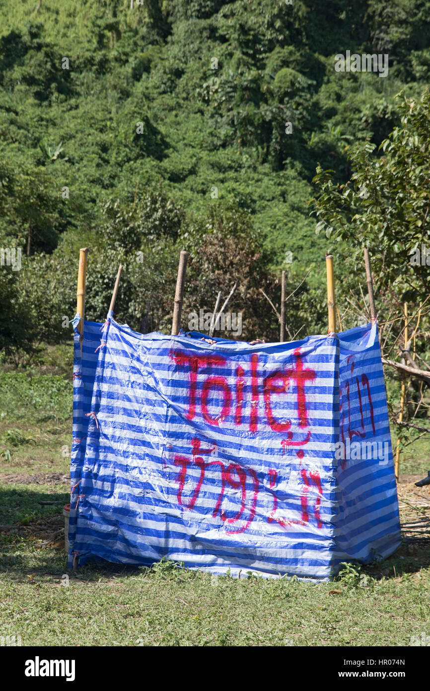 Fence with a cover tarp as the public toilets in the nature, Laos Stock Photo