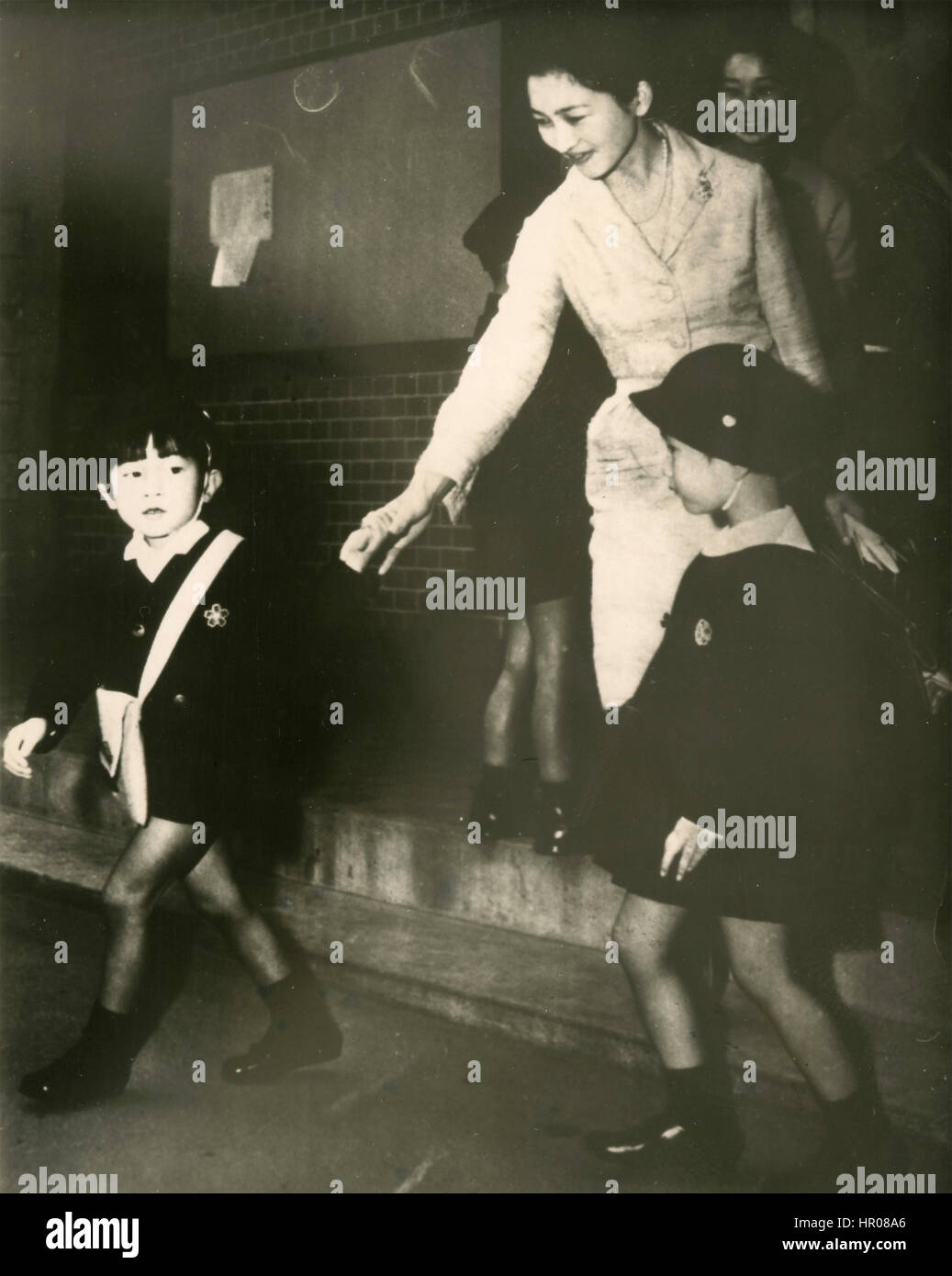 Crown Princesse Michiko and little Prince Hiro (left) getting out of school, Japan, 1966 Stock Photo