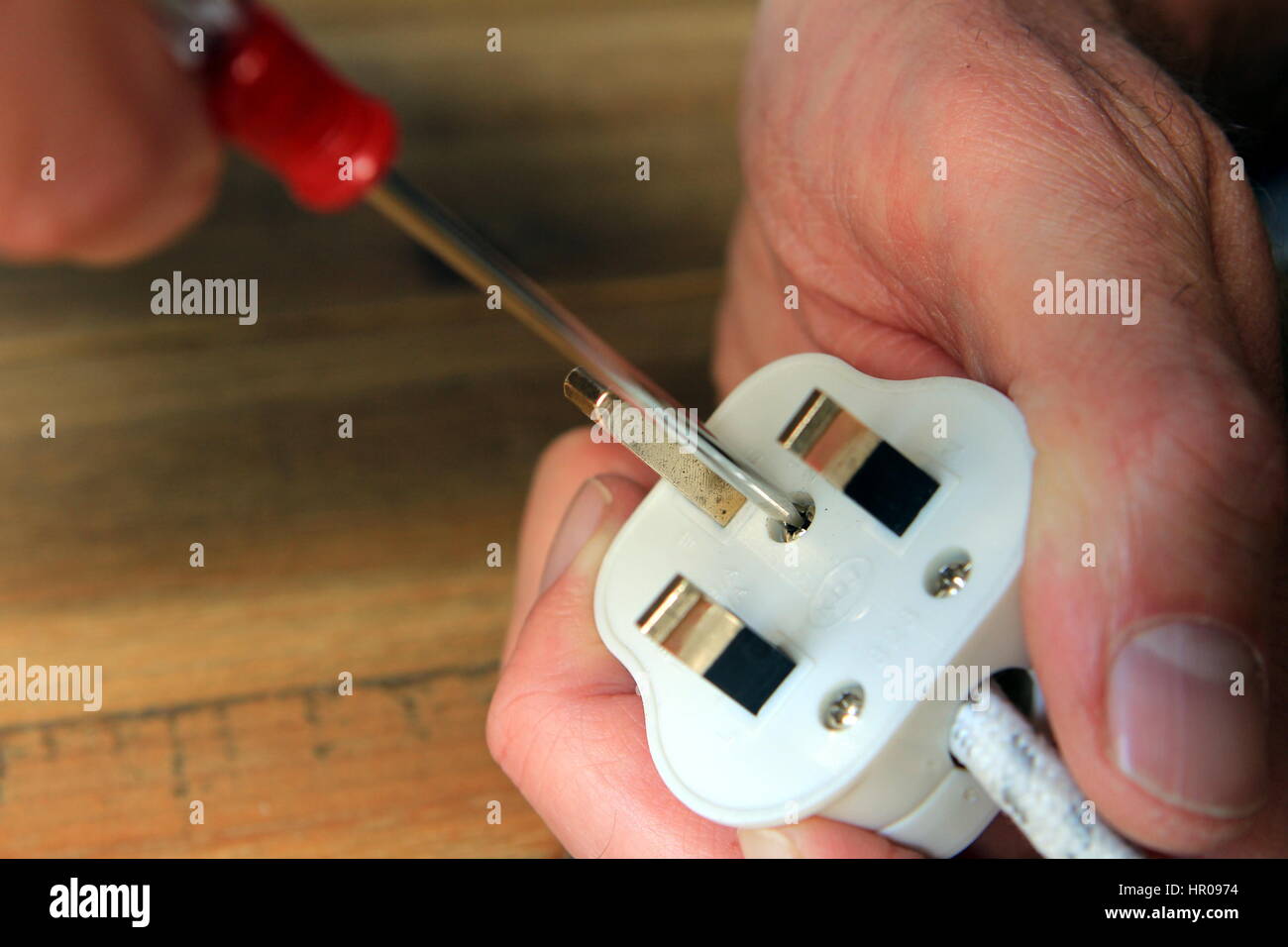 Opening A Uk 13 Amp Domestic Electric Plug To Change The Fuse Stock Photo Alamy