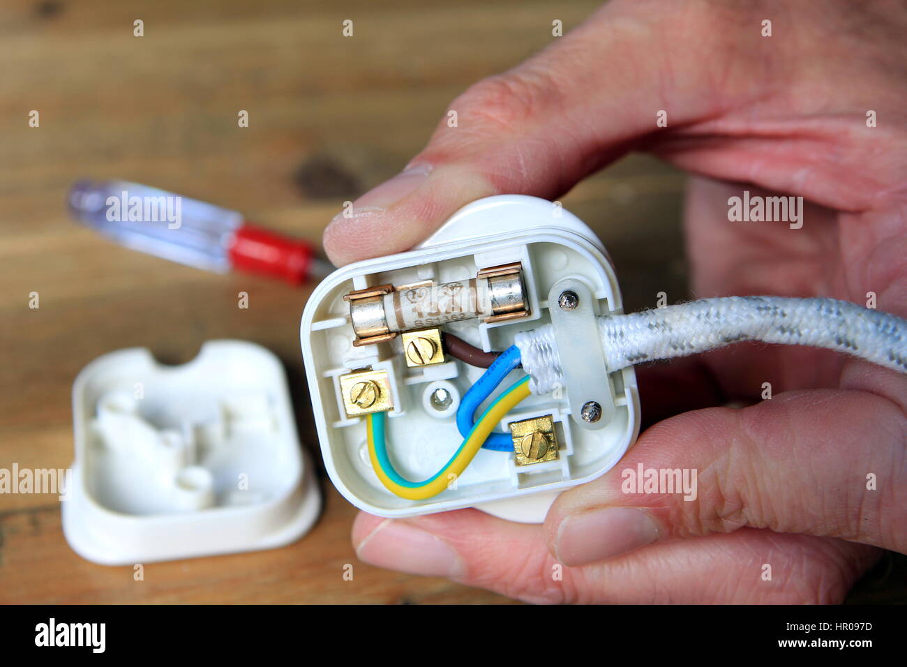 UK 13 amp domestic electric plug with back taken off to change the fuse