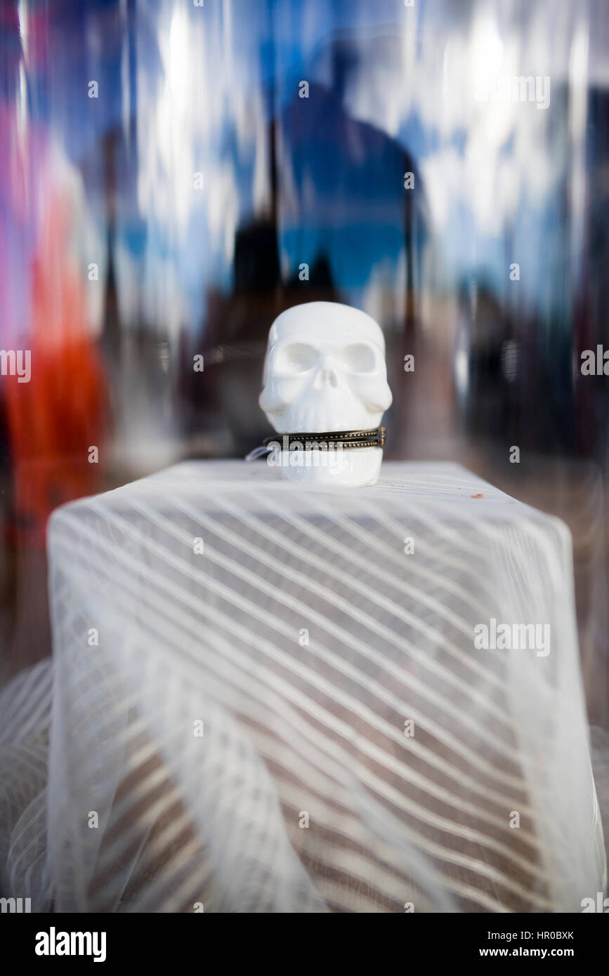 white ceramic skull with mouth zipped shut Stock Photo