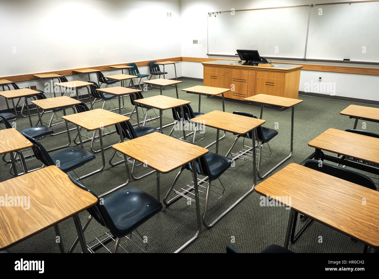 Empty classroom with student seating or desks. Stock Photo