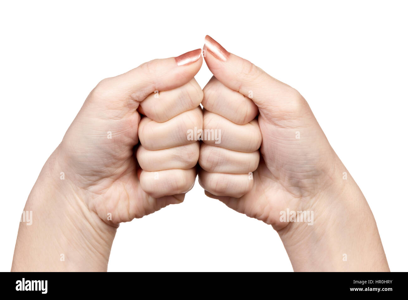 Gesture female hands two fists in contact with each other isolated on white background Stock Photo