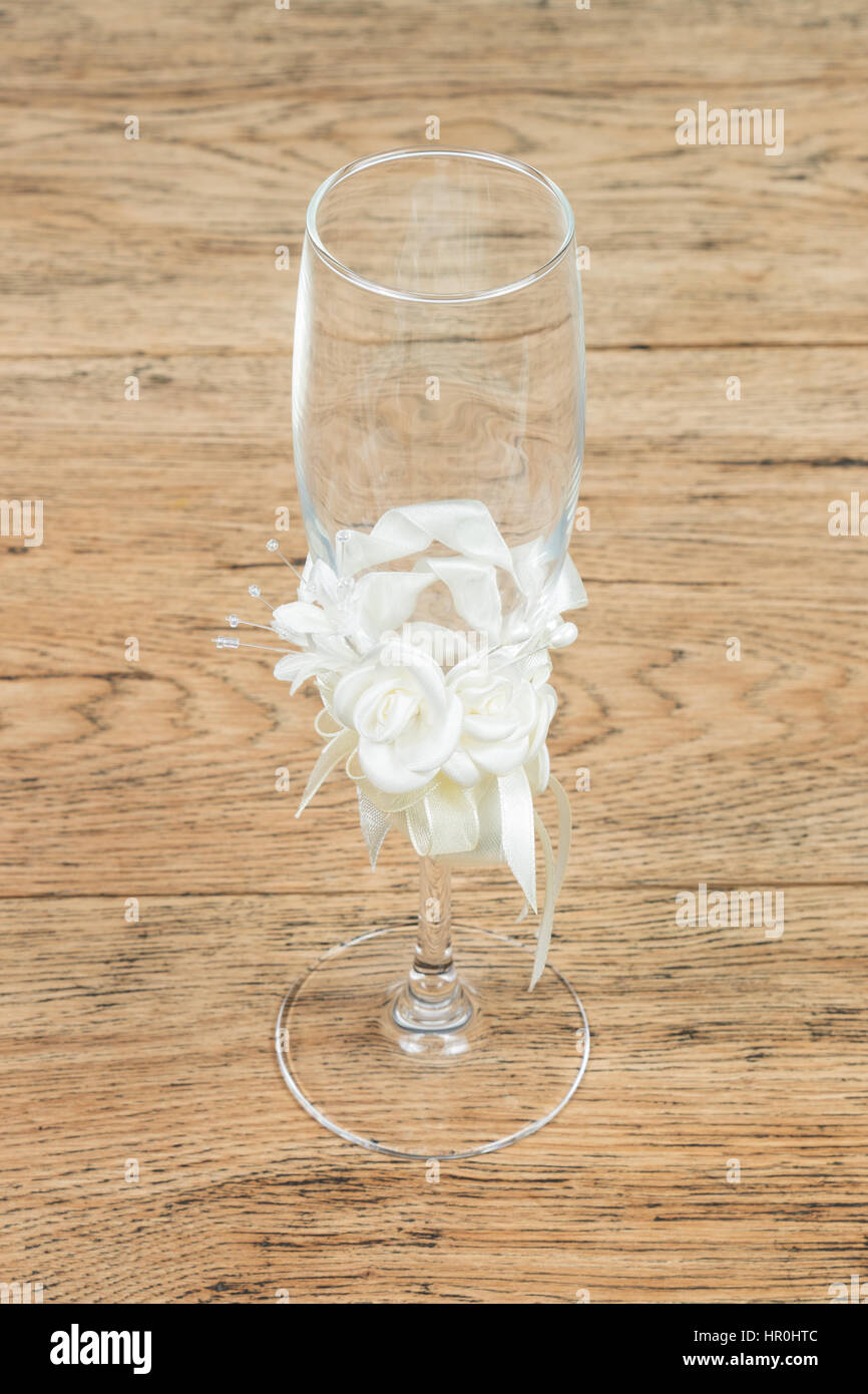 Beautiful Wedding Empty Glass Decorated With White Roses Ribbons