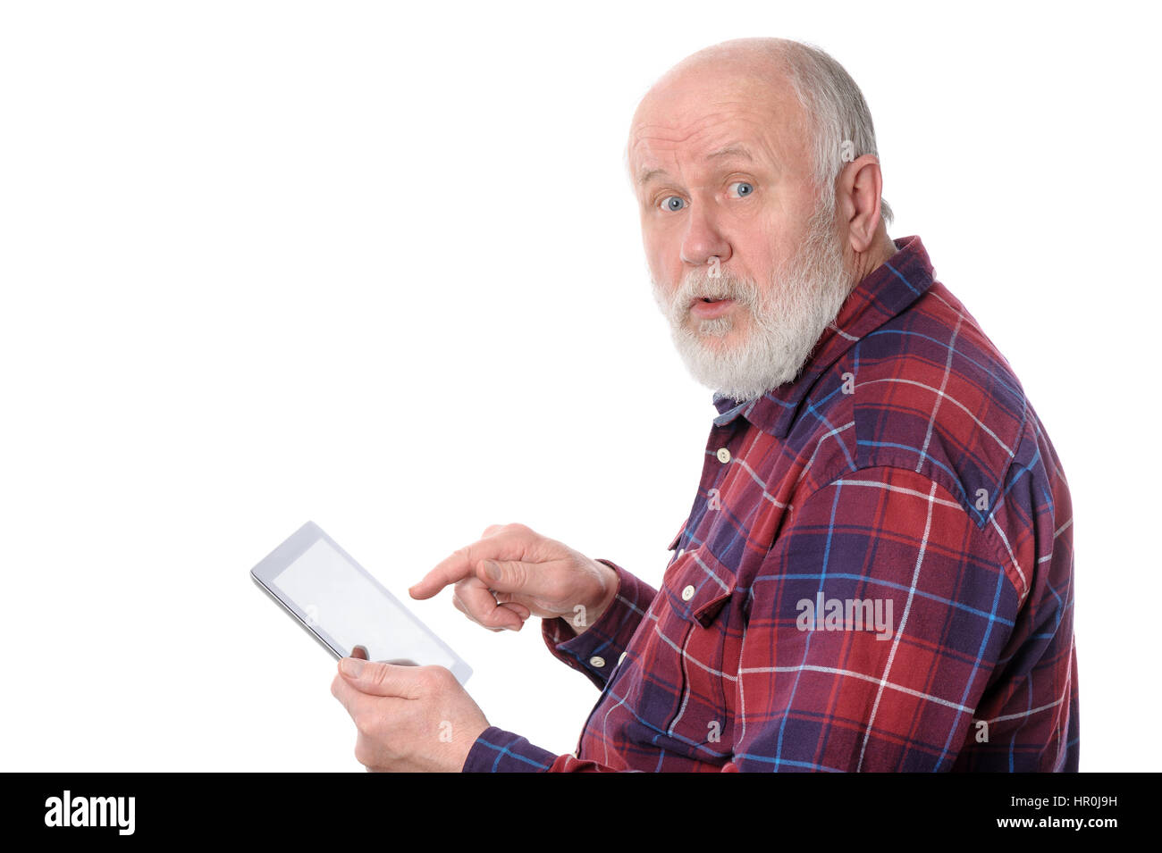 Senior bald and bearded white haired man touching something at tablet computer screen, isolated on white background Stock Photo