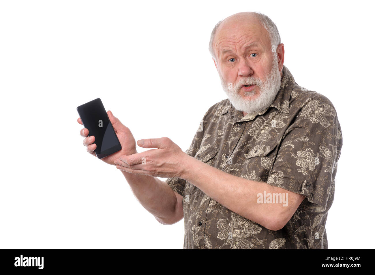 Senior upset bald and bearded white haired man showing something at smartphone screen, isolated on white background Stock Photo