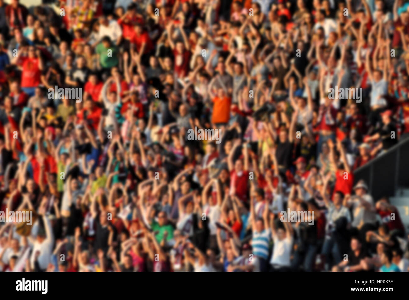 Crowd in a stadium. Blurred heads and faces of spectators Stock Photo