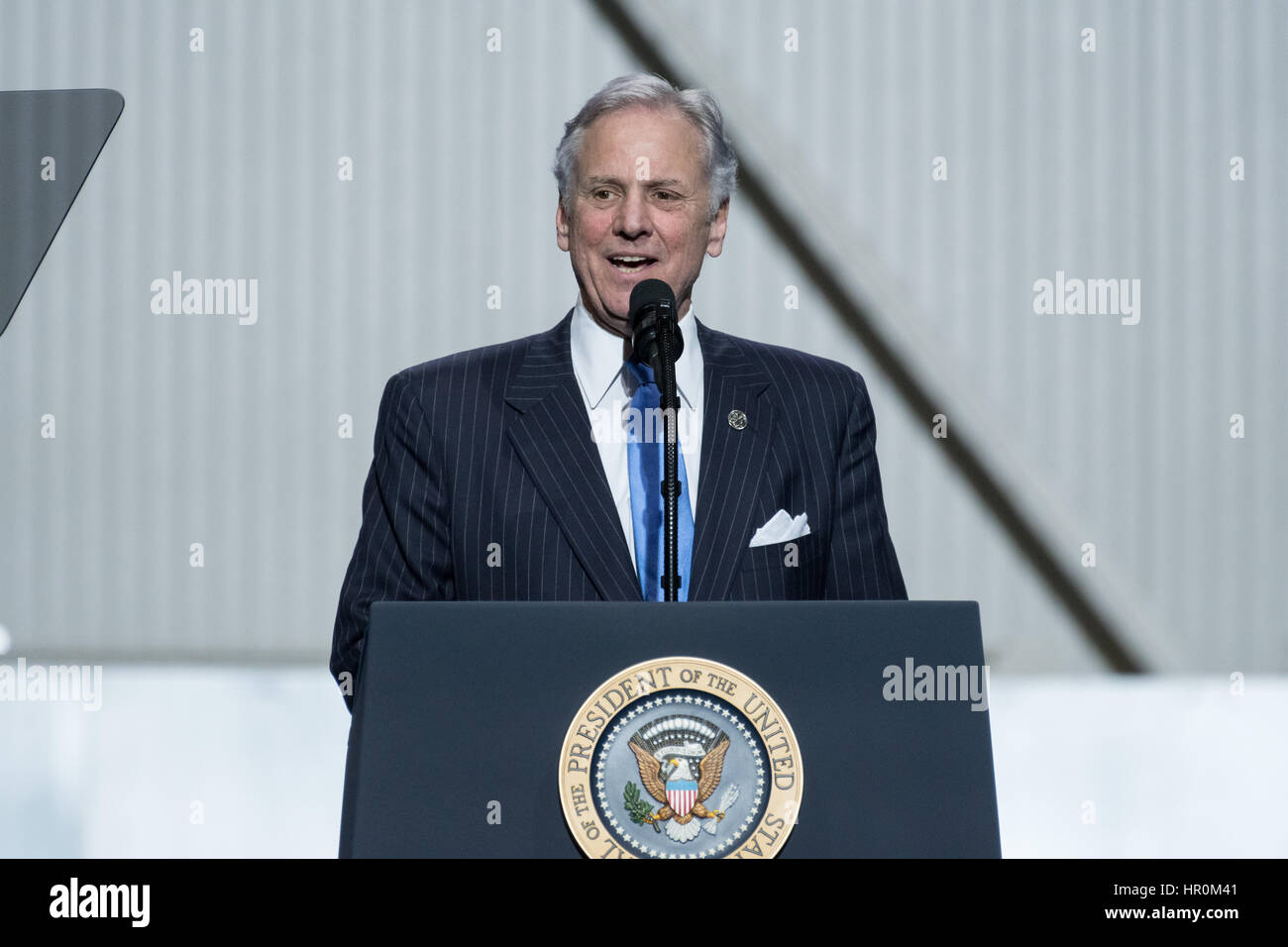 South Carolina Governor Henry McMaster addresses Boeing employees before U.S. President Donald Trump during the debut of the new Boeing 787-10 Dreamliner aircraft at the Boeing factory February 17, 2016 in North Charleston, SC. Trumps visit comes two days after workers at the South Carolina plant voted to reject union representation in a state where Trump won handily. Stock Photo