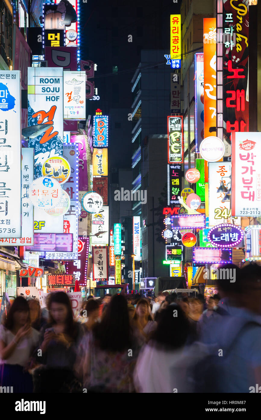 Seoul, South Korea - 14 August 2014: The view of the shopping street at night crowded with people and neon lights on 14 August 2014 in Seoul, South Ko Stock Photo
