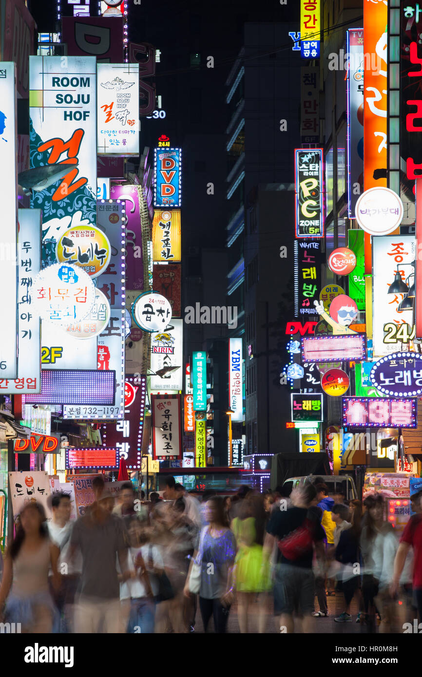 Seoul, South Korea - 14 August 2014: The view of the shopping street at night crowded with people and neon lights on 14 August 2014 in Seoul, South Ko Stock Photo