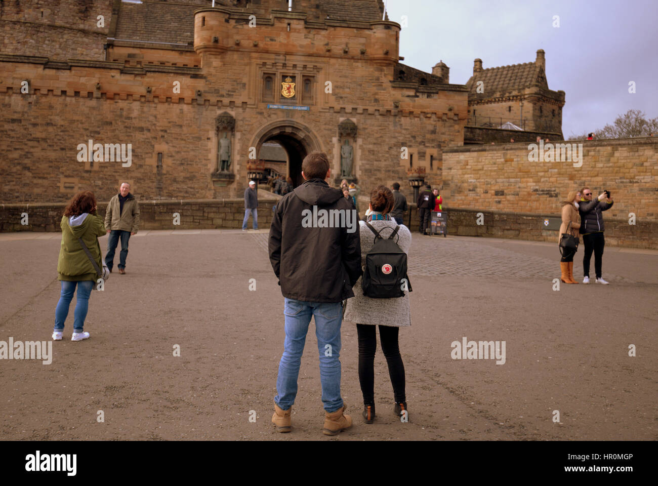 Edinburgh castle tourists on the ramparts inside the castle taking ...