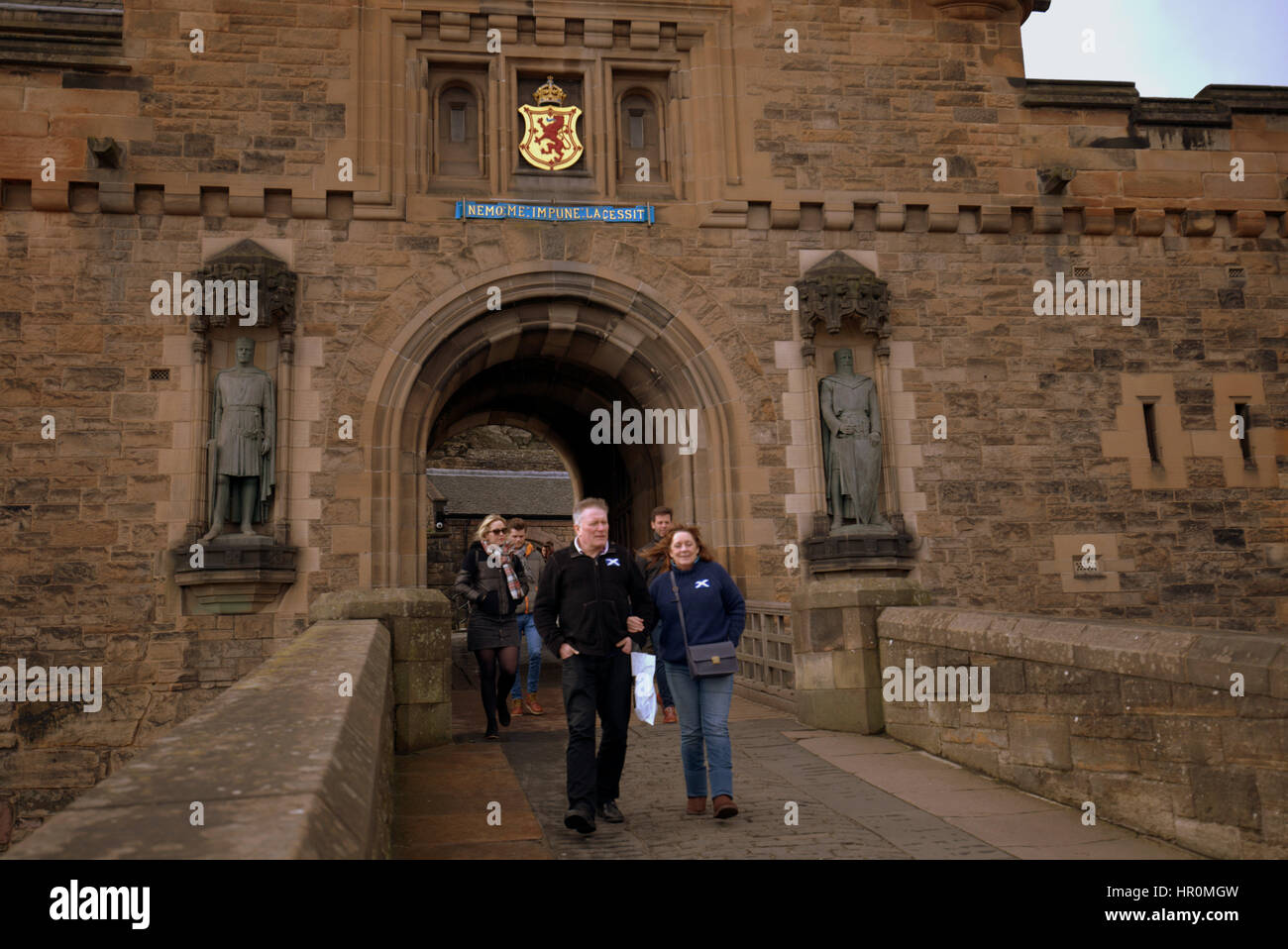 Edinburgh castle tourists on the ramparts inside the castle taking ...