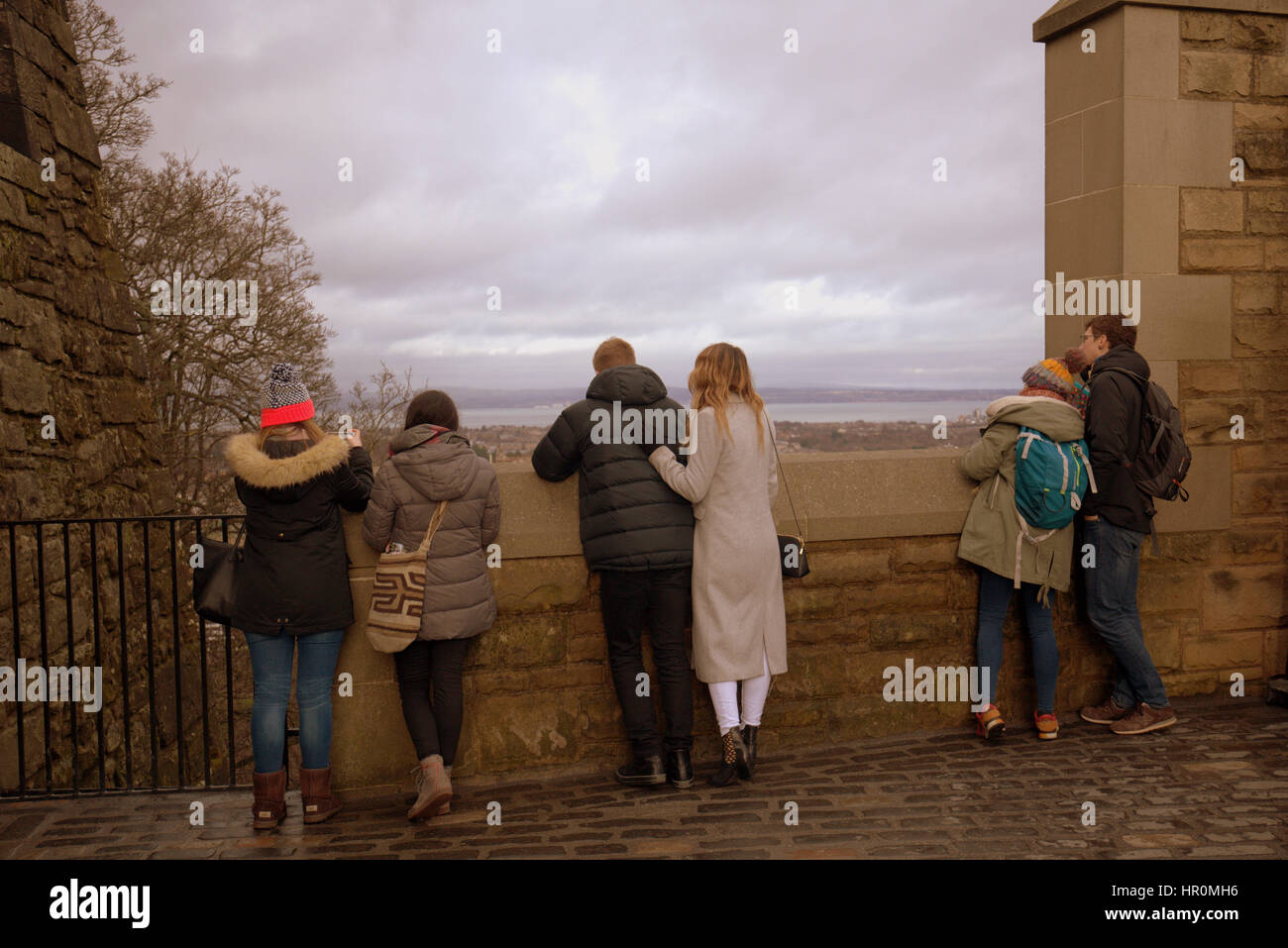 Edinburgh castle tourists on the ramparts inside the castle taking ...
