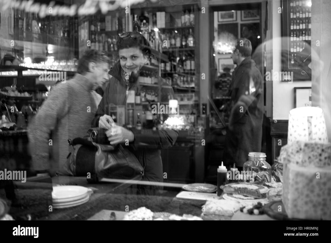 Interior of a historical cafe with visitors inside - shot through a window Stock Photo