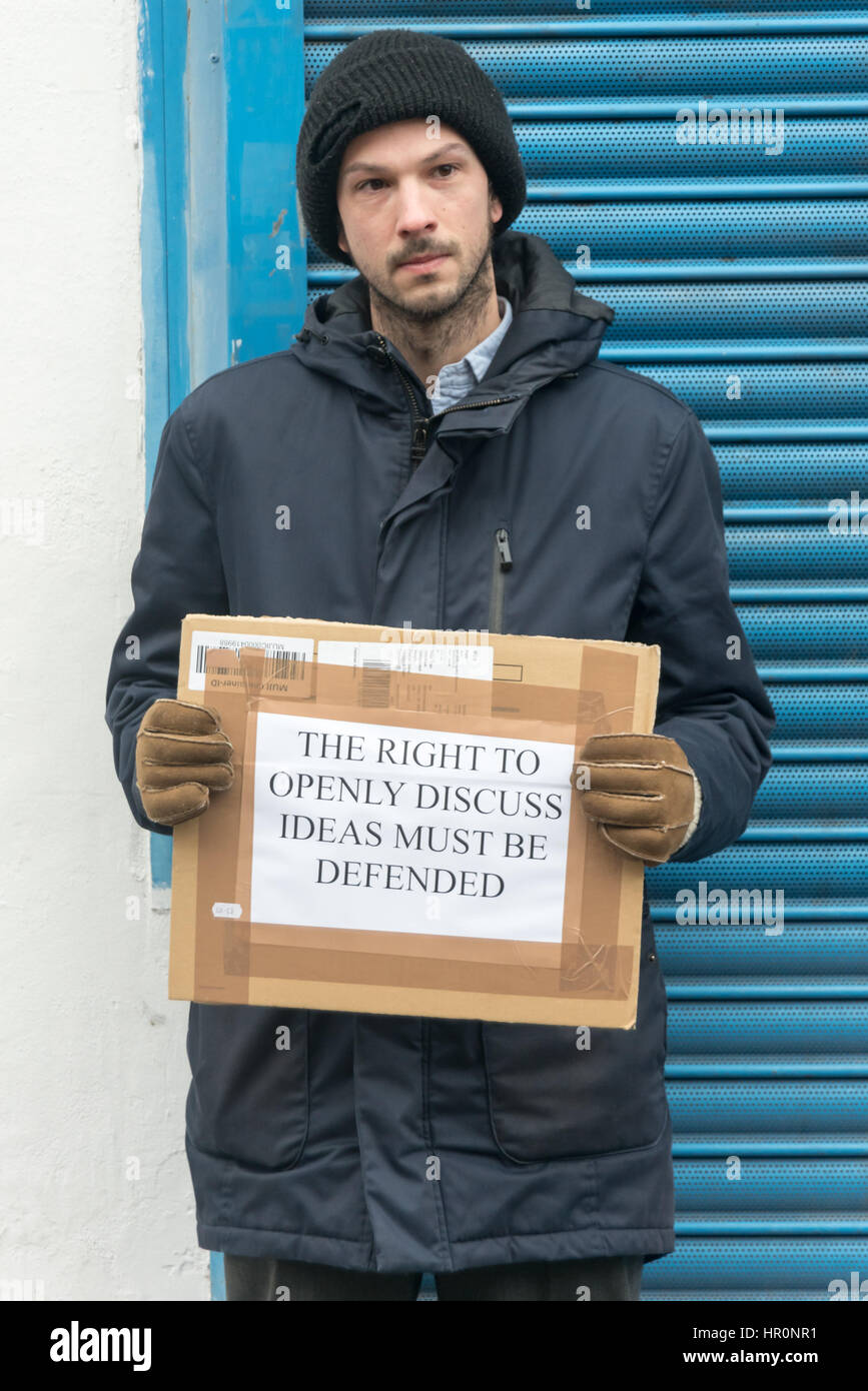 London, UK. 25th February 2017.  One man stands outside the LD50  gallery in Dalston and defends that the right to freely discuss ideas, even repulsive ones. He was shouted at by protesters and eventually police took him aside and advised him to leave. Several hundred people from East London had gathered outside the  gallery which they say has promoted fascists, neo-Nazis, misogynists, racists and Islamophobes in one of London's more diverse areas. Credit: Peter Marshall/Alamy Live News Stock Photo