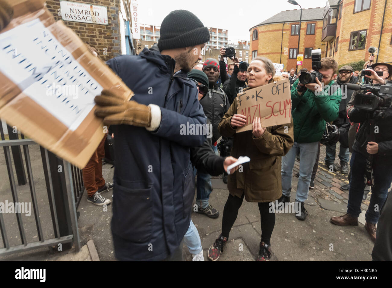 London, UK. 25th February 2017.  Protesters argue with a man outside the LD50  gallery in Dalston who says he has come to defend that the right to freely discuss ideas, even repulsive ones. He was shouted at by protesters and eventually police took him aside and advised him to leave. Several hundred people from East London had gathered outside the  gallery which they say has promoted fascists, neo-Nazis, misogynists, racists and Islamophobes in one of London's more diverse areas. Credit: Peter Marshall/Alamy Live News Stock Photo