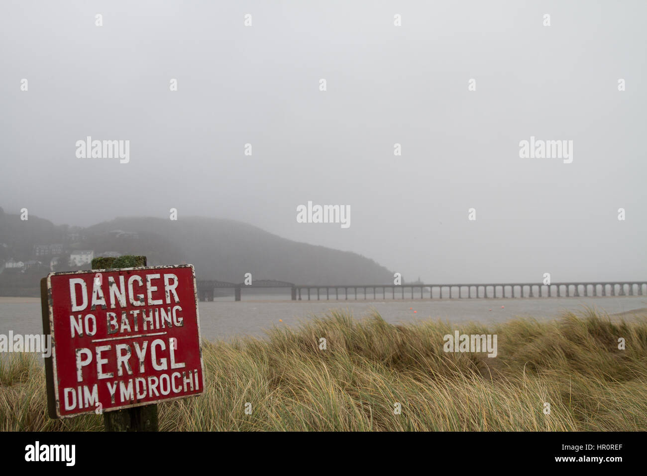 Barmouth, Wales, UK. 25th February, 2017.  UK Weather, Mist and rain in Mid Wales as the grey sky is enough to put people of bathing in the Mawddach Estuary, Barmouth, Welsh Coast. Stock Photo
