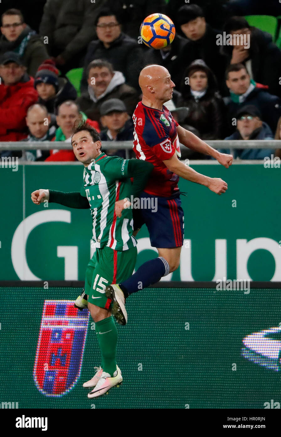 Budapest, Hungary. 25th February 2017. Tamas Hajnal #15 of Ferencvarosi TC battles for the ball in the air with Jozsef Varga (R) of Videoton FC during the Hungarian OTP Bank Liga match between Ferencvarosi TC and Videoton FC at Groupama Arena on February 25, 2017 in Budapest, Hungary. Credit: Laszlo Szirtesi/Alamy Live News Stock Photo