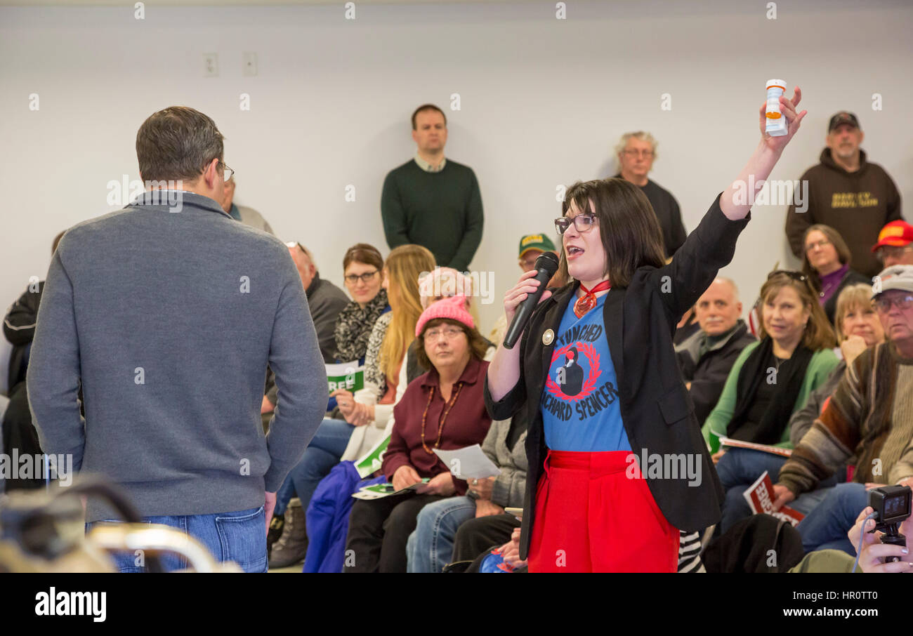 Hastings, Michigan, USA. 25 February 20Hastings, Michigan, USA. 25 February 2017.17. Republican Congressman Justin Amash (back to camera) holds a town hall meeting to hear from his constituents in Michigan's Third Congressional District. Many questioners expressed strong opposition to Republicans' plan to repeal the Affordable Care Act. This woman displayed her prescription drugs which she said cost her more than $1,000 a month. Credit: Jim West/Alamy Live News Stock Photo