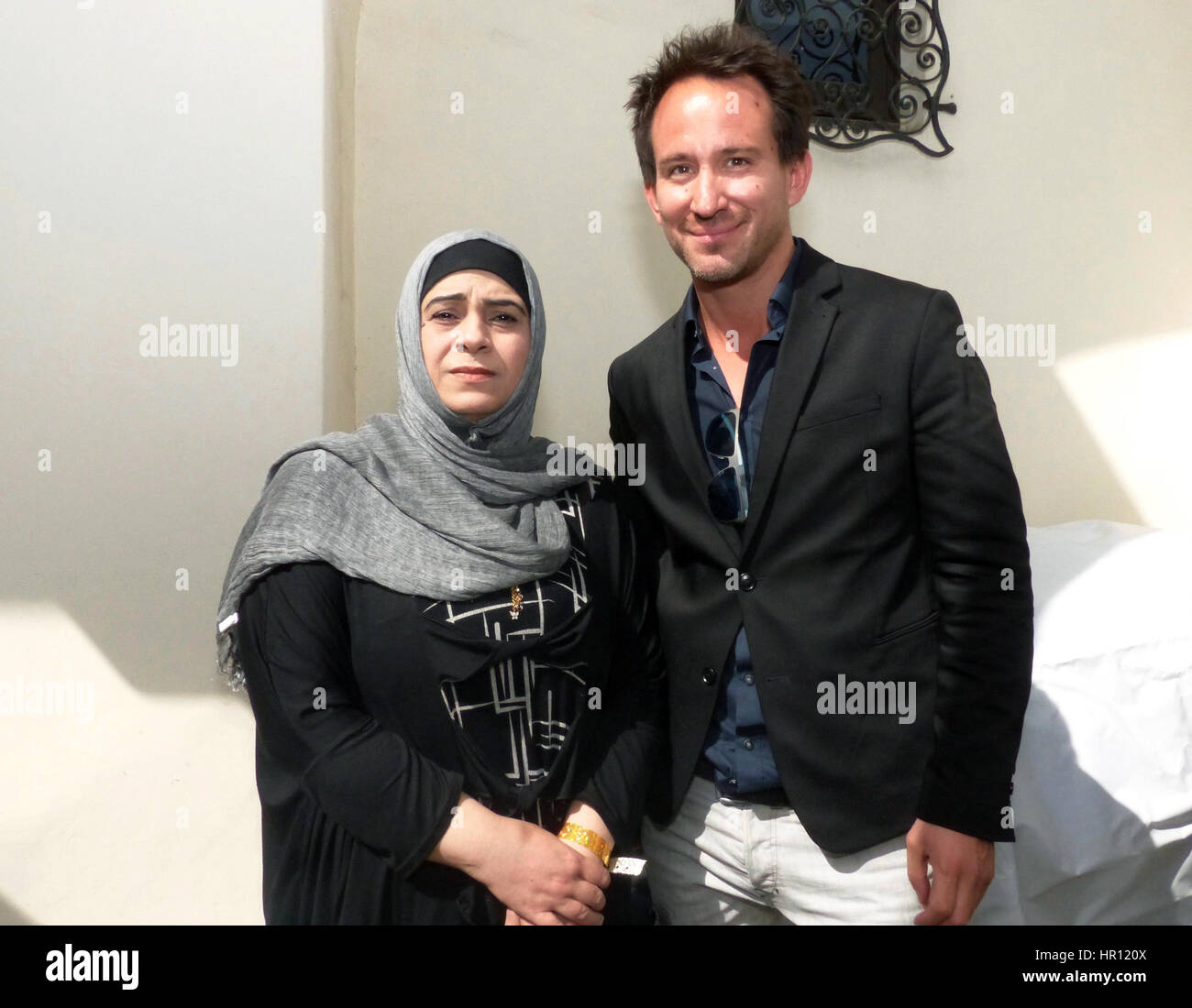 Los Angeles, US. 25th Feb, 2017. Documentary film maker Marcel Mettelsiefen and Hala Kamil from Syria, the central figure of his refugee documentary 'Watani: My Homeland, photographed during the traditional reception for the German Oscar nominees at the historical Villa Aurora in Los Angeles, US, 25 February 2017. The Academy Award ceremony takes place on 26 February 2017. Photo: Barbara Munker/dpa/Alamy Live News Stock Photo