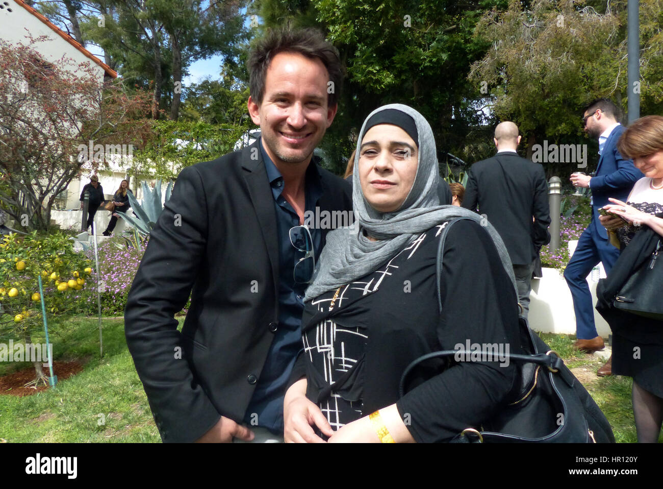 Los Angeles, US. 25th Feb, 2017. Documentary film maker Marcel Mettelsiefen and Hala Kamil from Syria, the central figure of his refugee documentary 'Watani: My Homeland, photographed during the traditional reception for the German Oscar nominees at the historical Villa Aurora in Los Angeles, US, 25 February 2017. The Academy Award ceremony takes place on 26 February 2017. Photo: Barbara Munker/dpa/Alamy Live News Stock Photo