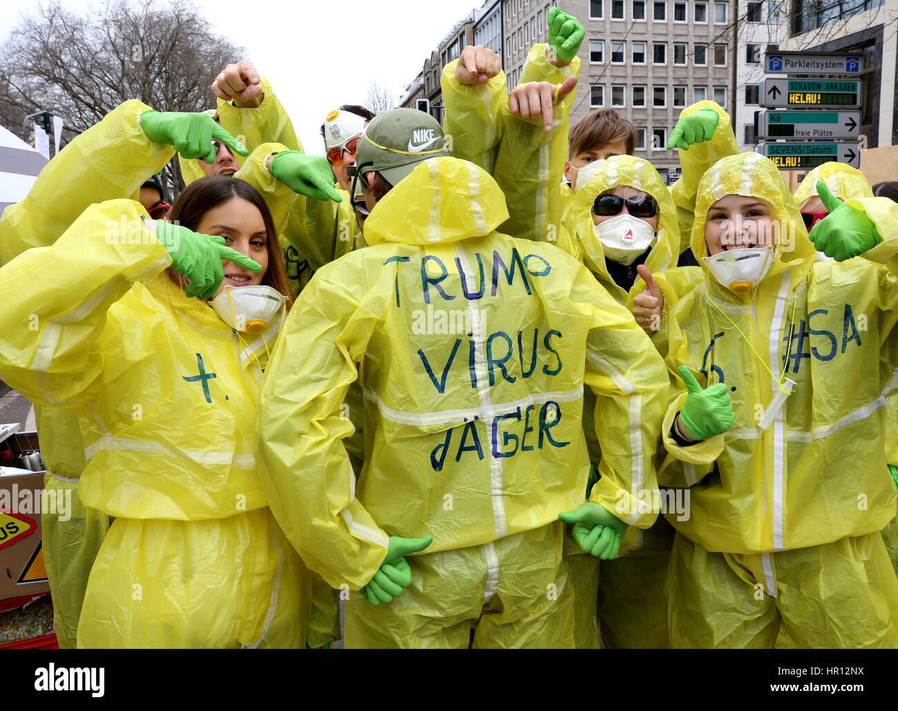 Duesseldorf, Germany. 26th Feb, 2017. 'Trump Virus Jaeger' (lit. 'Trump  Virus Hunters') is written on the costumes of a group of young people at  the carnival parade in Duesseldorf, Germany, 26 February