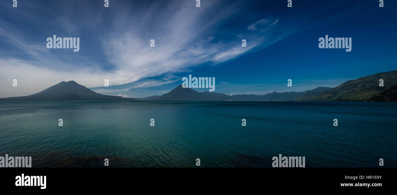 Panoramic view of Atitlan lake with volcanoes in the background - Panajachel, Guatemala Stock Photo