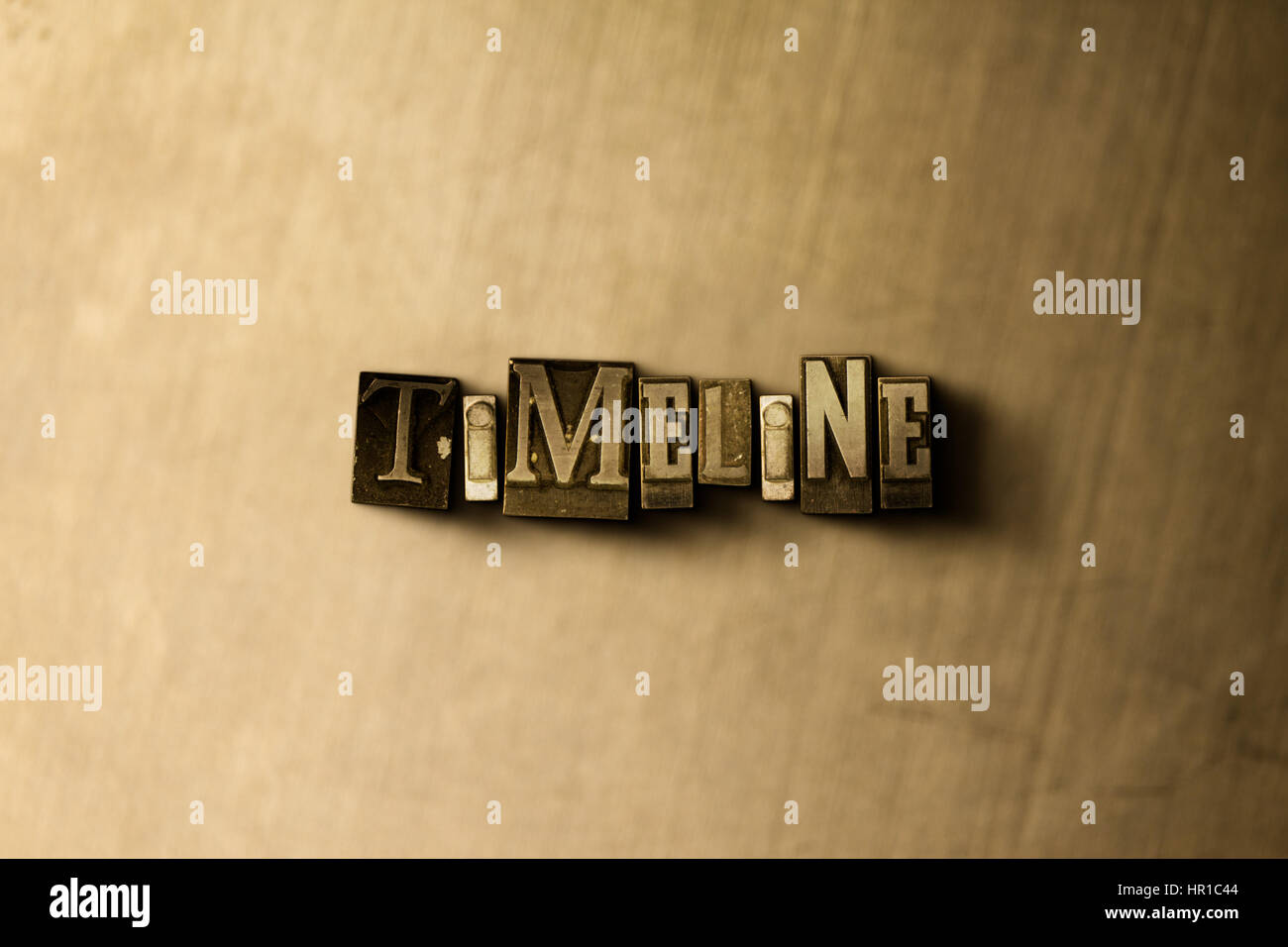 TIMELINE - close-up of grungy vintage typeset word on metal backdrop ...