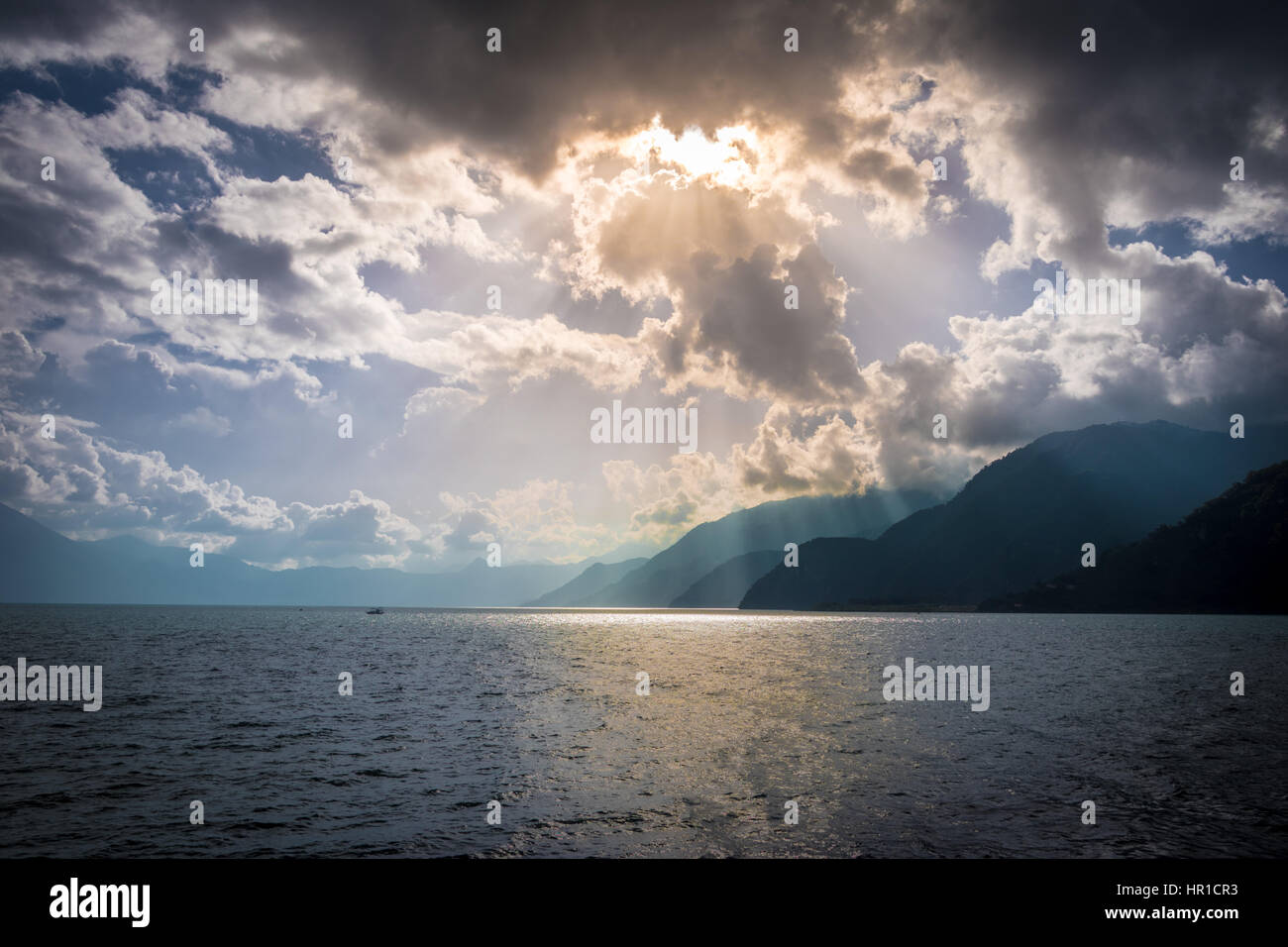 God Rays and Mountains at Atiltan Lake - Panajachel, Guatemala Stock Photo