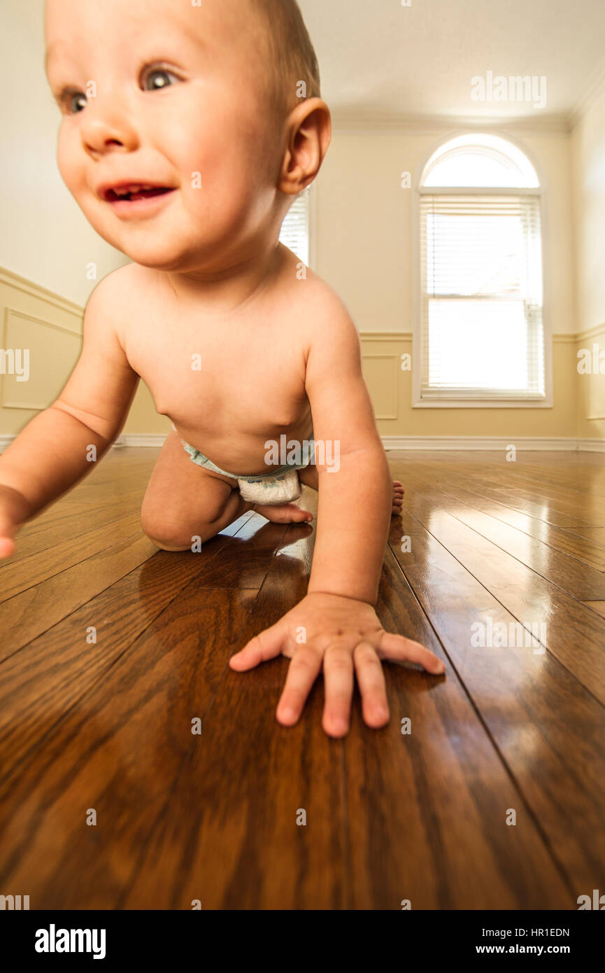 infant boy in an empty room Stock Photo - Alamy